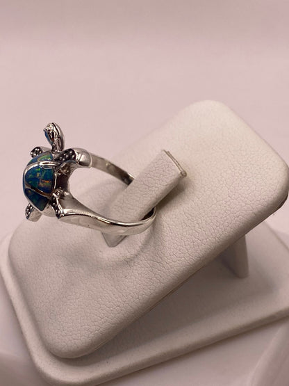 Anillo Tortuga Marina en Plata Ley 950 con Ópalo de Fuego, vista lateral