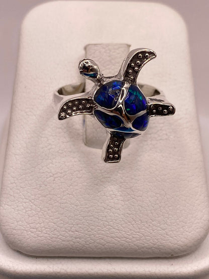 Anillo Tortuga Marina de Plata Ley 950 con Ópalo de Fuego, sello de autenticidad Plata Ley .925