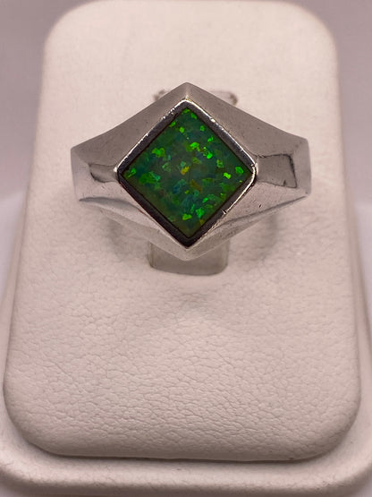 Anillo de plata .950 con ópalo de fuego verde limón en estuche blanco