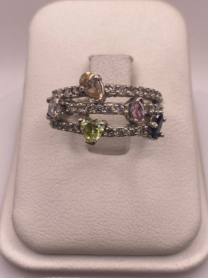 Anillo de plata .925 con circonias multicolor blanco, amarillo y violeta en caja de presentación