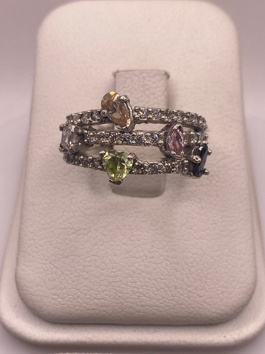 Anillo de plata .925 con circonias multicolor blanco, amarillo y violeta en caja de presentación