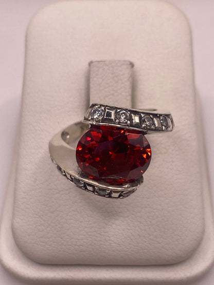 Anillo solitario de plata con circonia naranja brillante montado a mano en Taxco