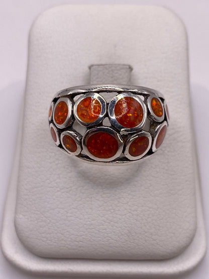 Anillo de plata .925 con ópalo de fuego naranja, vista frontal en estuche