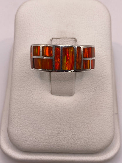 Anillo de plata .950 con ópalo de fuego naranja engastado geométricamente