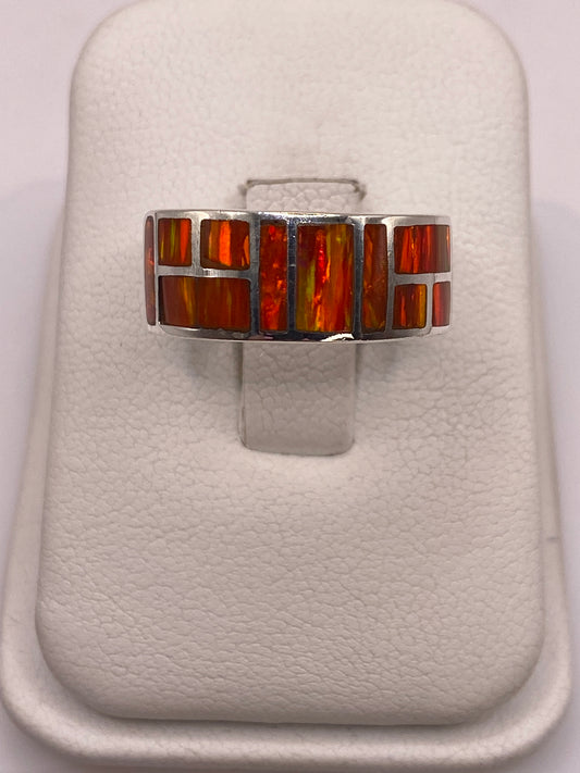 Anillo de plata .950 con ópalo de fuego naranja engastado geométricamente