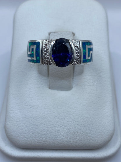 Anillo de plata .950 con ópalo de fuego azul en diseño solitario minimalista