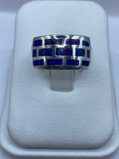 Anillo de plata .950 con ópalo de fuego multicolor en diseño geométrico asimétrico