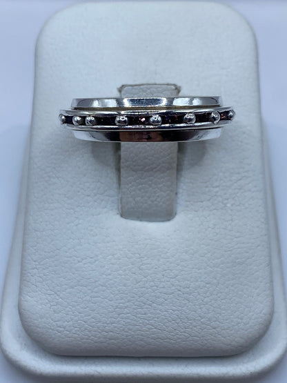 Anillo giratorio de plata con circonia rosa en estuche blanco