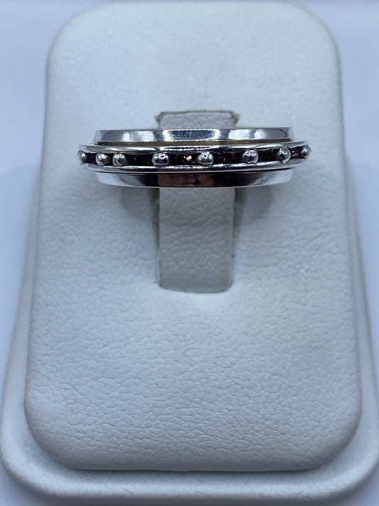 Anillo giratorio de plata con circonia rosa en estuche blanco