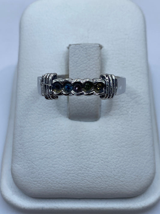 Anillo de plata con circonias multicolor en tonos azul, verde y champagne