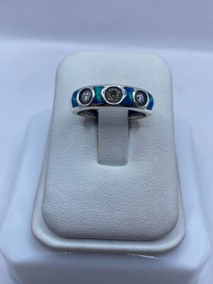 Anillo de plata .950 con tres ópalos de fuego azul engastados en Taxco