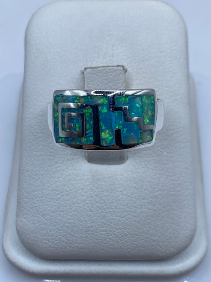 Anillo de plata .950 con ópalo de fuego azul cielo en caja blanca