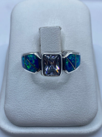 Anillo de plata .925 con tres ópales de fuego azul, diseño geométrico asimétrico