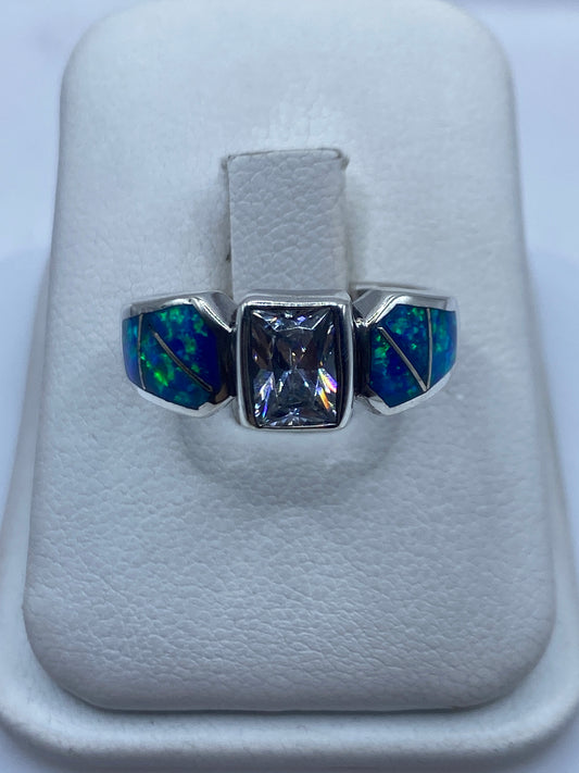 Anillo de plata .925 con tres ópales de fuego azul, diseño geométrico asimétrico