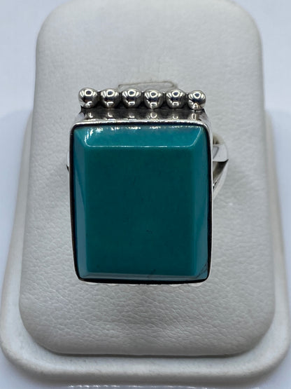 Anillo de plata .925 con turquesa azul cielo y coronilla de esferas artesanales