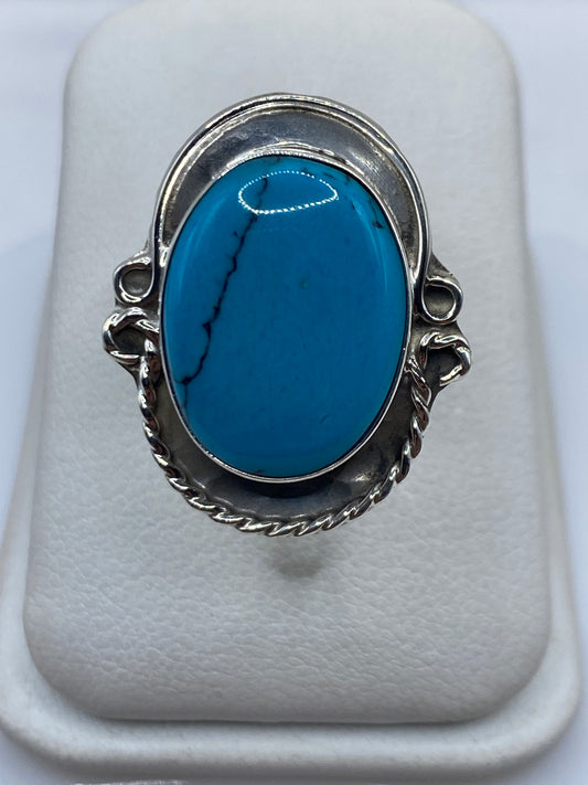 Anillo de plata ajustable con turquesa azul cielo y marco retorcido de Taxco