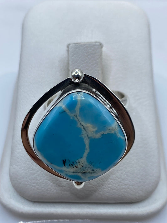 Anillo de plata ajustable con piedra azul cielo natural en estuche blanco
