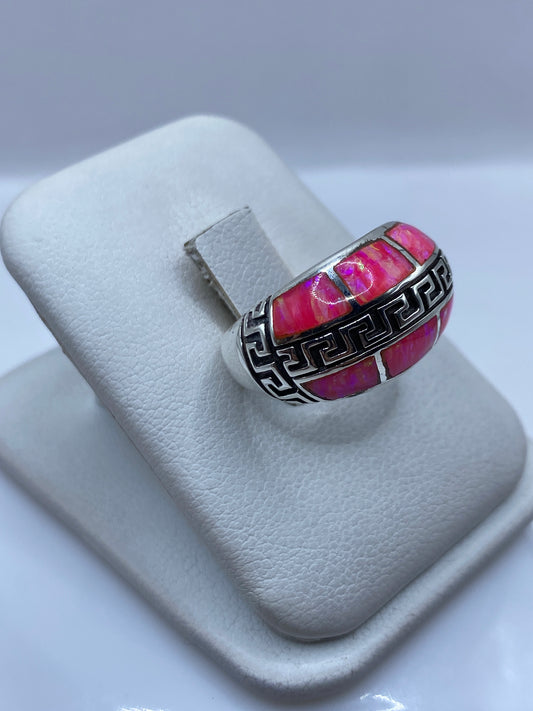 Detalle del Ópalo de Fuego mostrando fuego rosa, naranja y dorado en plata .950