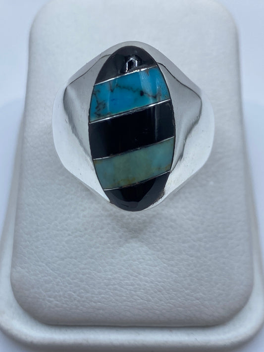 Anillo de plata .925 con turquesa azul cielo engastada en incrustación de Taxco