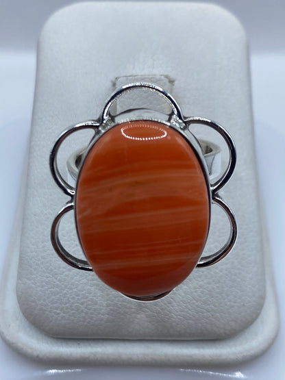 Anillo de plata ajustable con diseño floral y piedra engastada en el centro