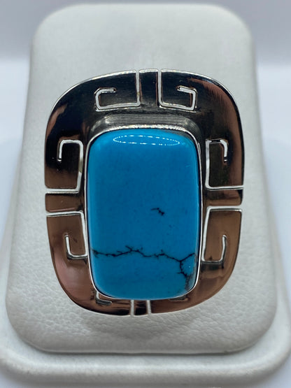 Anillo de plata .925 ajustable con turquesa azul cielo y marco geométrico prehispánico, vista frontal
