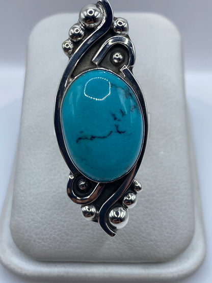 Anillo de plata ajustable con turquesa azul cielo y esferas decorativas, vista frontal