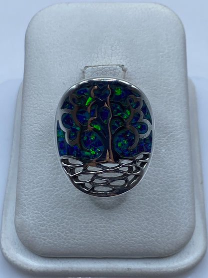 Anillo de plata .950 con Ópalo de Fuego morada engastado, vista frontal en estuche blanco