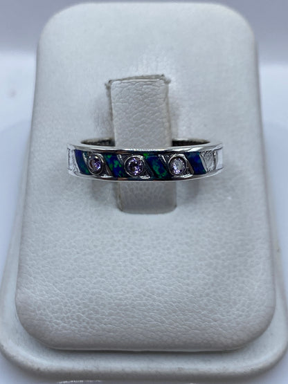 Anillo de plata .950 con Ópalo de Fuego azul, engaste visible en Taxco