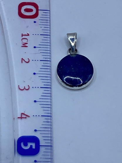 Medida y peso del dije: 1.3 gramos de plata pura