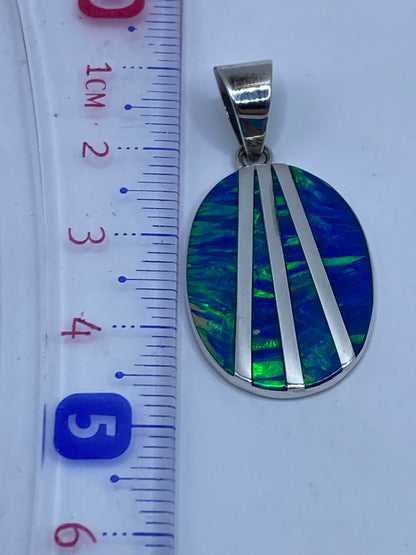 Reverso del dije mostrando el Quinto .950 grabado en plata