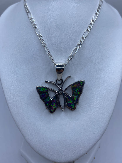 Engaste a mano del ópalo de fuego en dije mariposa de Taxco