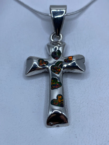 Cruz dije de plata .950 con ópalo multicolor engastado a mano