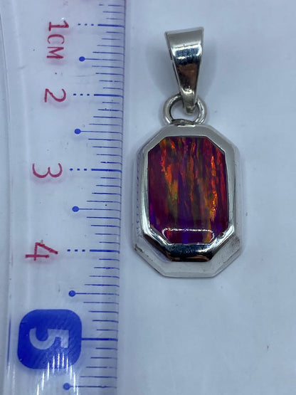 Reverso del dije mostrando el Quinto .950 grabado y acabado pulido