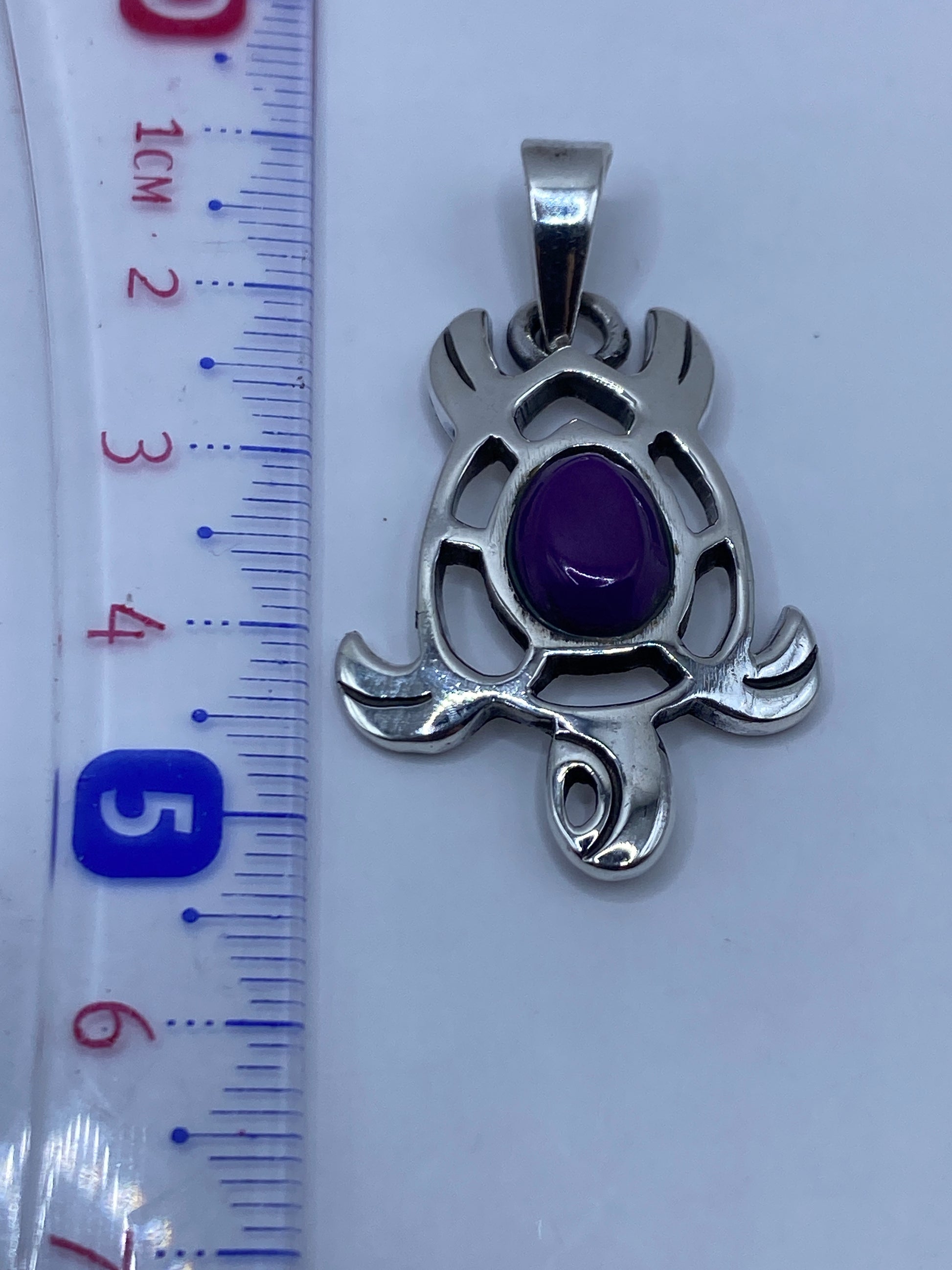 Medida del dije con regla: 5 cm de largo, plata .950 auténtica