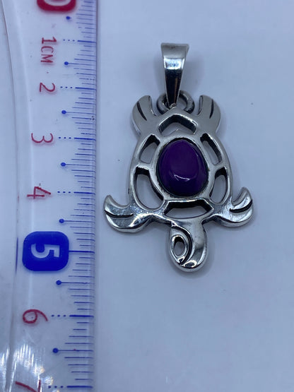 Medida del dije con regla: 5 cm de largo, plata .950 auténtica