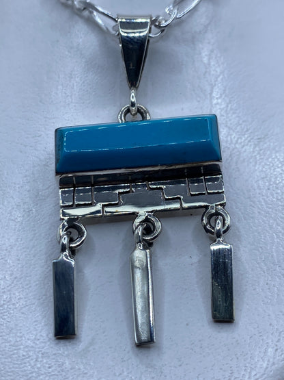 Dije de plata .950 con turquesa azul engastada en diseño geométrico de Taxco, largo 6 cm