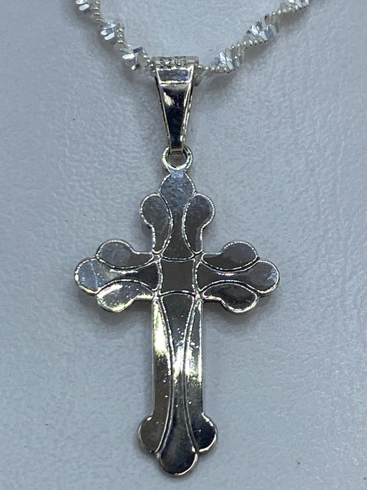 Dije de cruz en plata .925 de Taxco, 3 cm de largo, con brazos decorativos