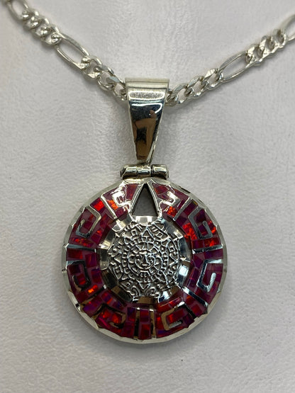 Detalle del engaste a mano del ópalo de fuego en plata .950