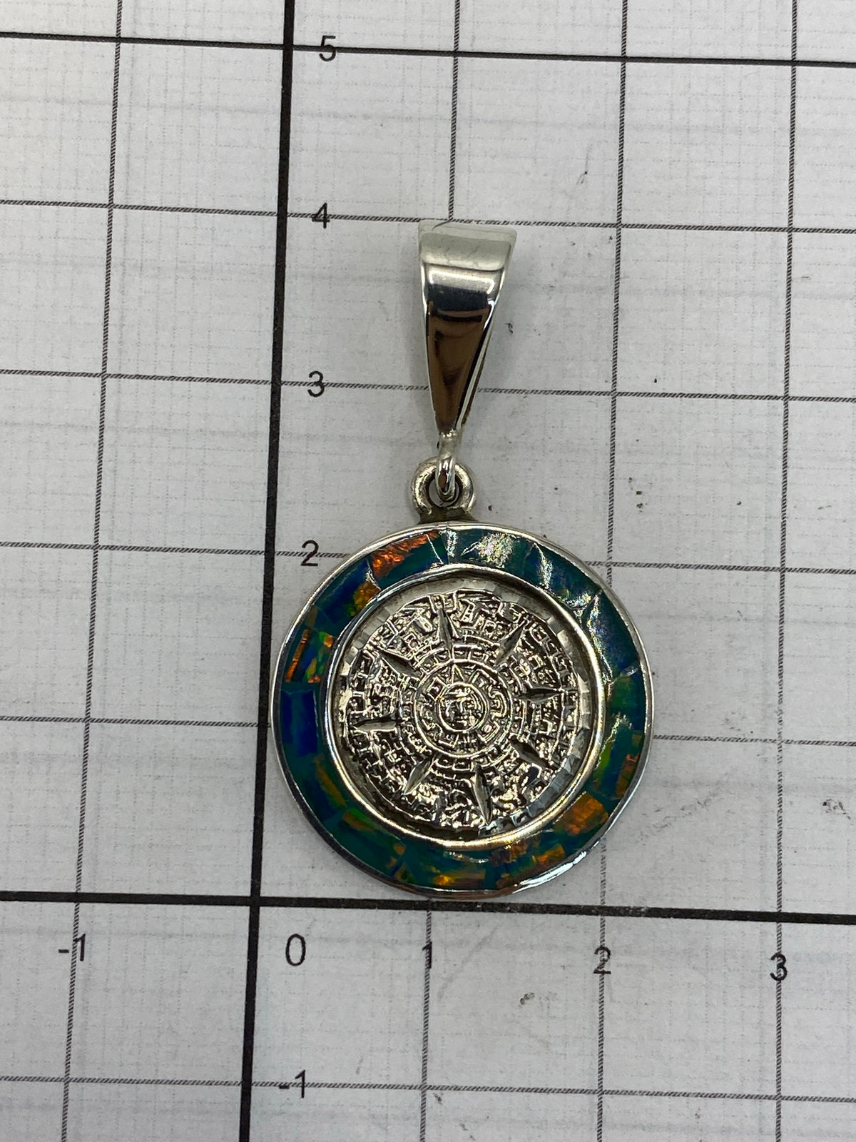 Reverso del dije de plata 950 con hallmark de Taxco y grabado de autenticidad
