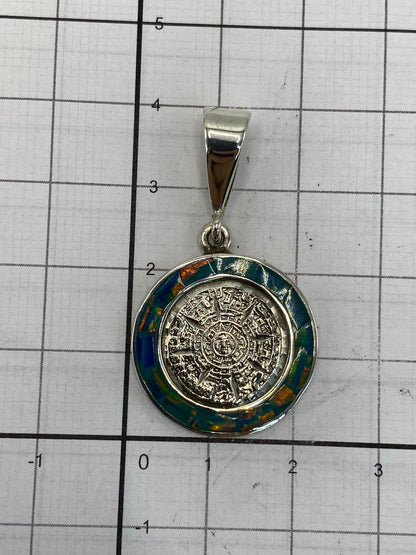 Reverso del dije de plata 950 con hallmark de Taxco y grabado de autenticidad