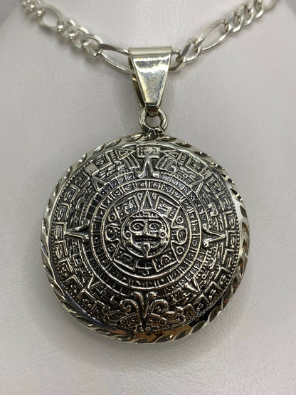 Dije de plata calendario azteca Taxco — vista frontal del calendario con glifos prehispánicos