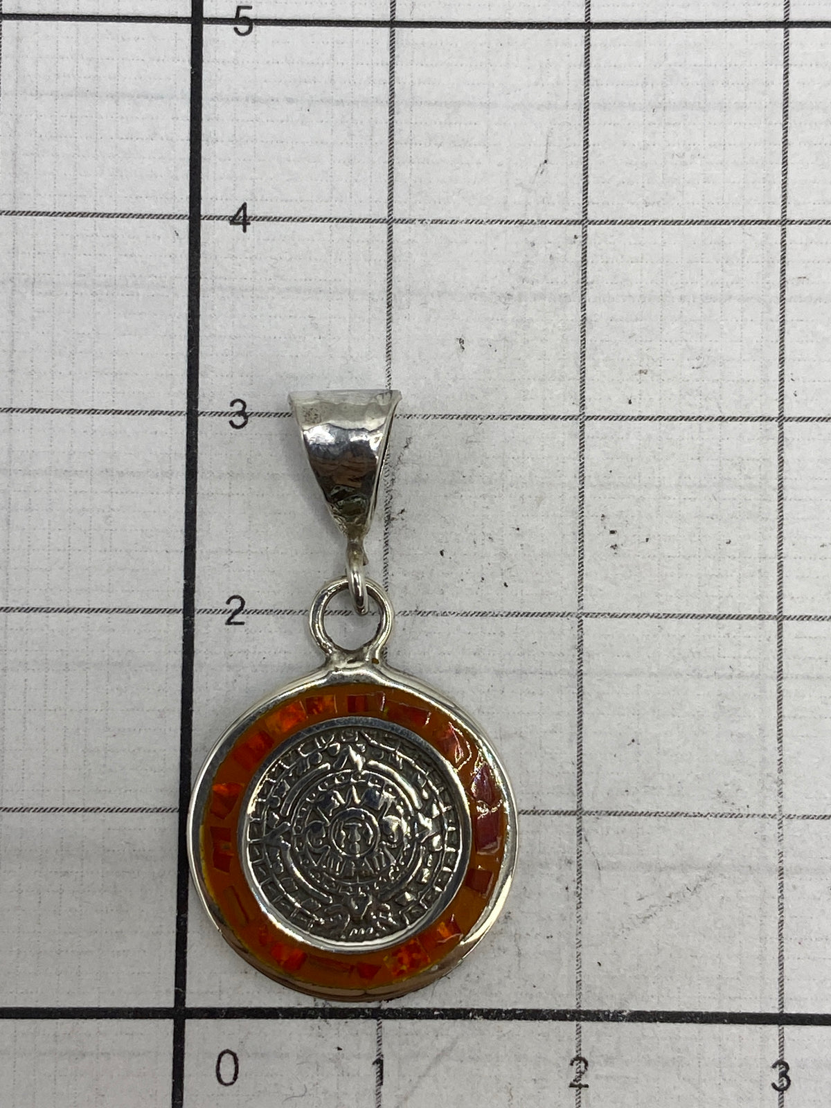 Reverso del dije de plata mostrando el Quinto 925 de autenticidad