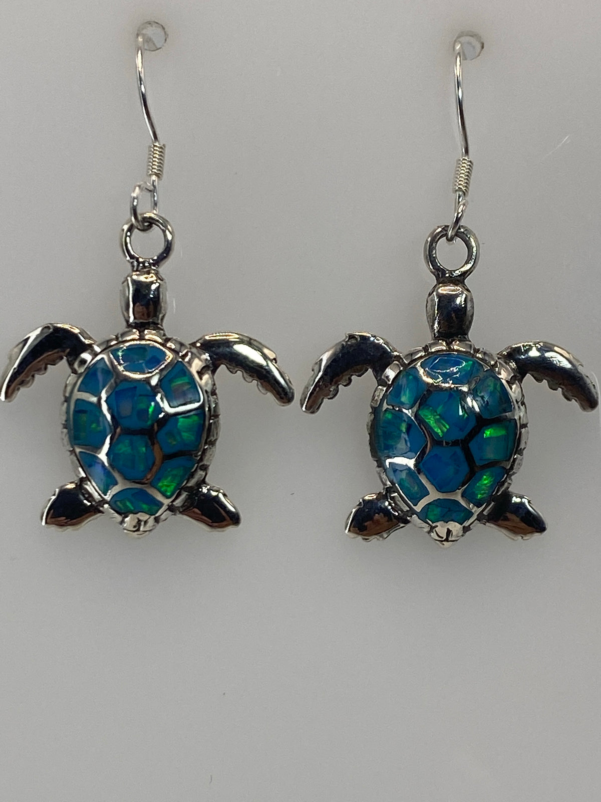 Aretes de 3.5 cm de largo con piedra azul brillante en plata pura
