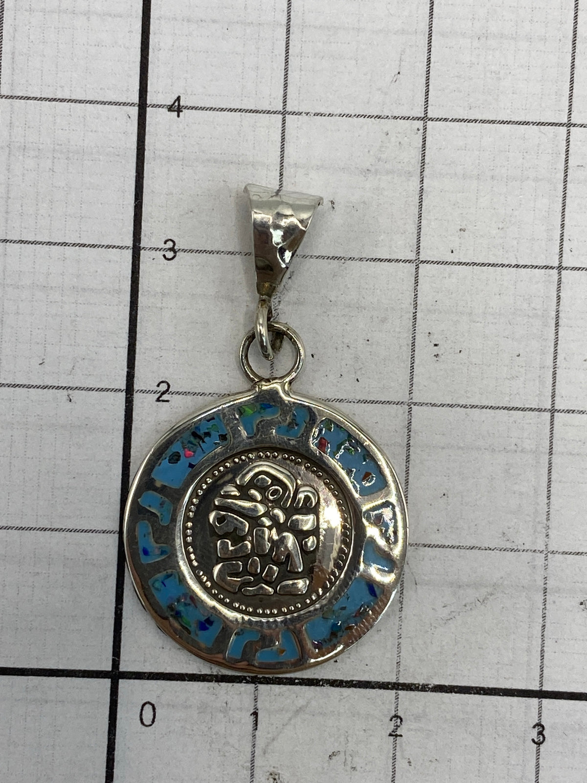 Reverso del dije mostrando el Quinto 925 y marca de Taxco