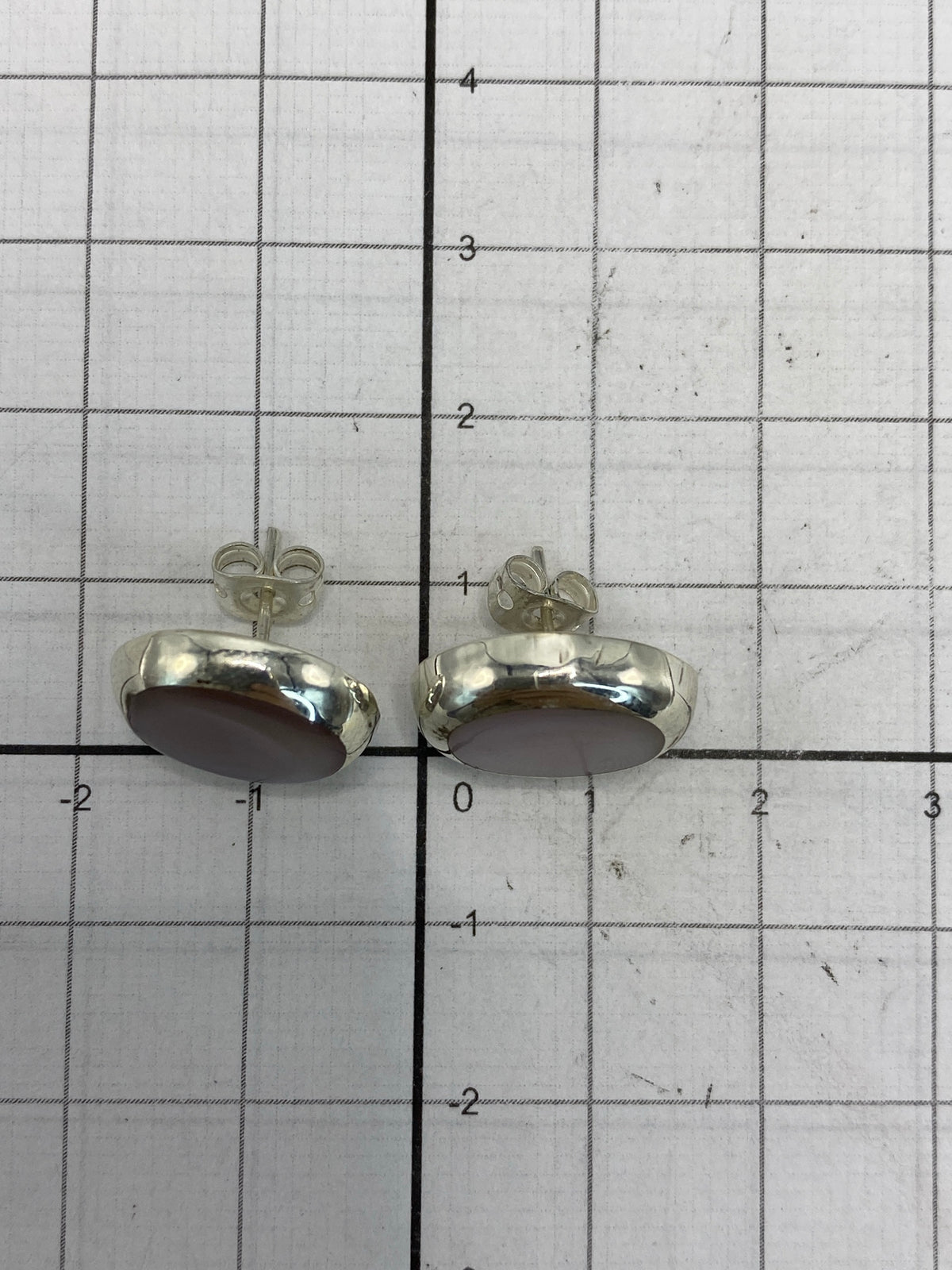 Aretes de plata en certificado de autenticidad con sello 925