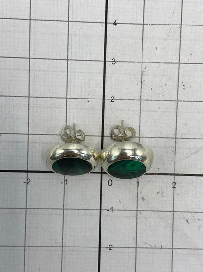 Aretes con Quinto 925 grabado, junto al certificado de autenticidad