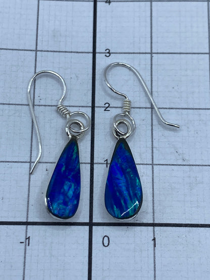Par de aretes completamente montados en estuche azul de Arte Taxco