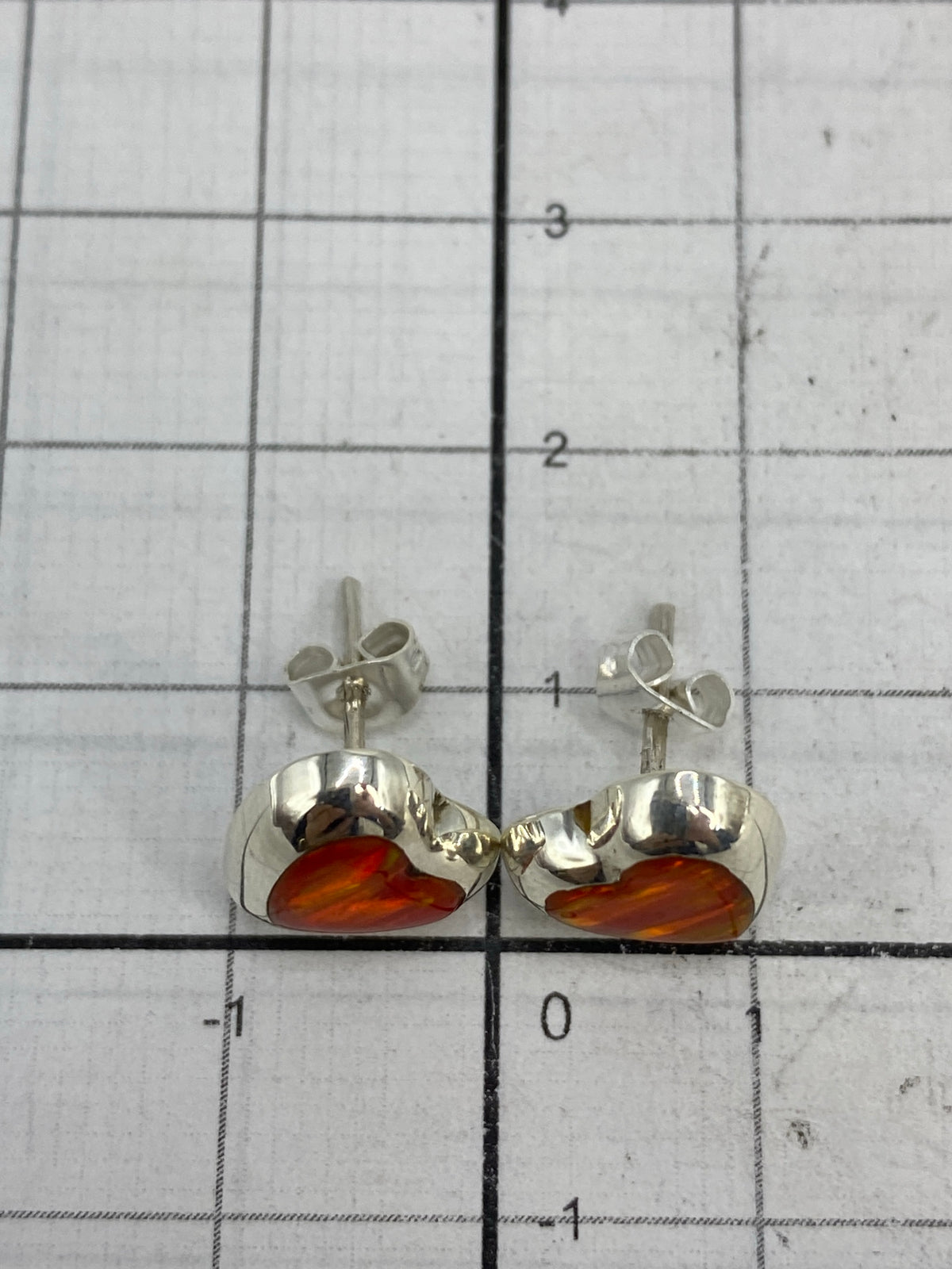 Reverso de los aretes mostrando el Quinto 925 en plata pura