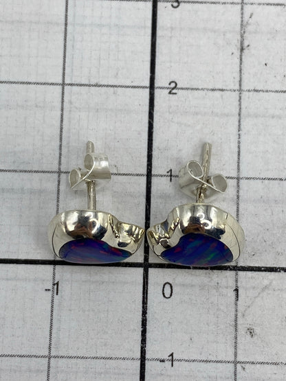 Aretes pesados en balanza: 1.4 gramos totales