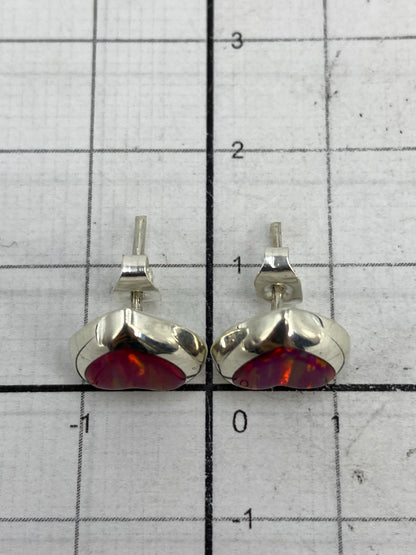 Reverso de los aretes mostrando el sello 925 y el poste con tuerca de plata